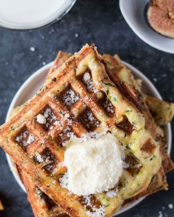 Zucchini Parmesan Waffles are a delicious way to celebrate National Waffle Day today! krollskorner.com