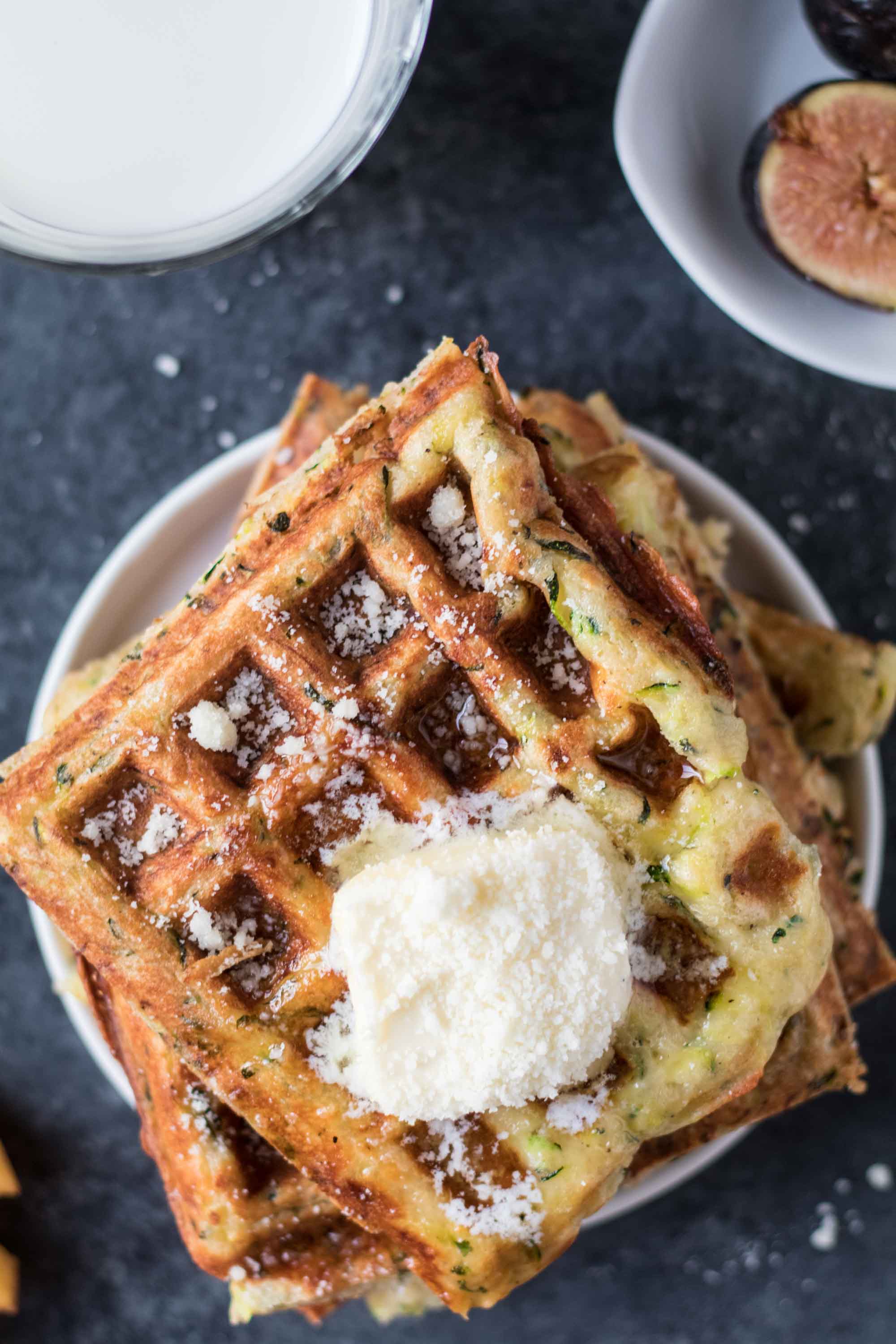 Zucchini Parmesan Waffles are a delicious way to celebrate National Waffle Day today! krollskorner.com