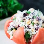 Chicken salad stuffed inside of a heirloom tomato.