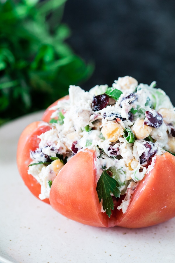 Chicken salad stuffed inside of a heirloom tomato.