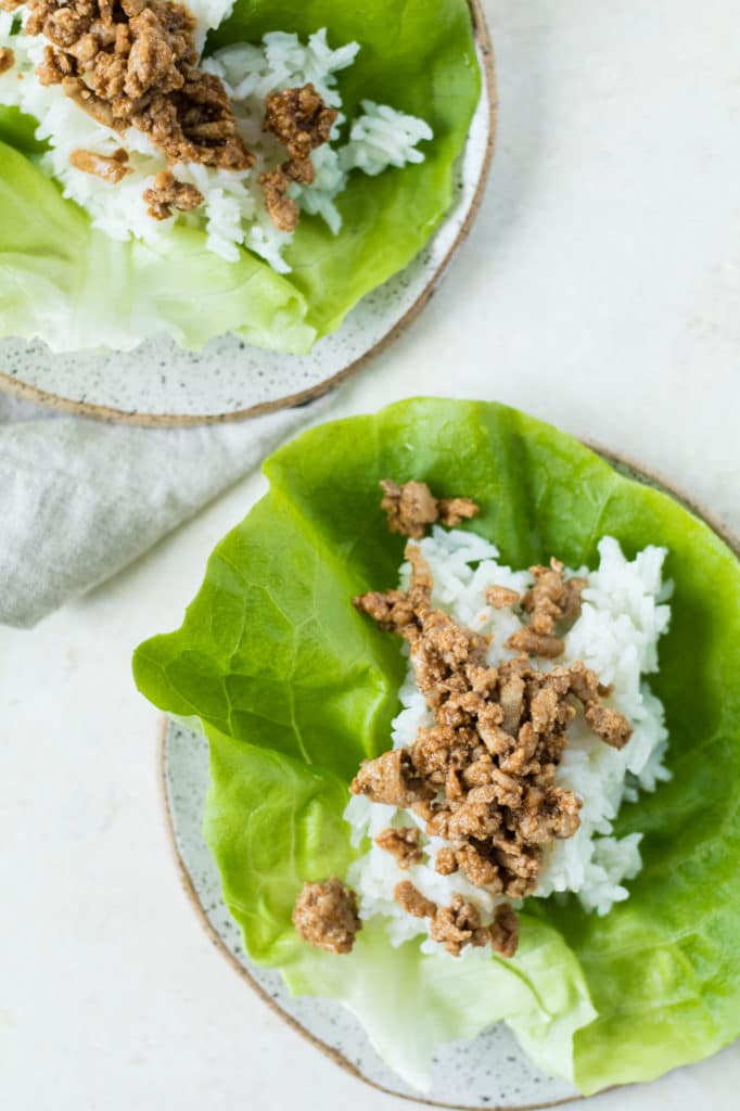 butter leaf lettuce filled with white rice and ground turkey