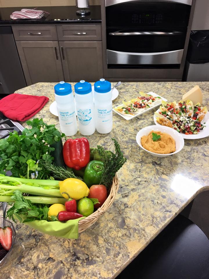 A kitchen filled with lots of different types of food on a table