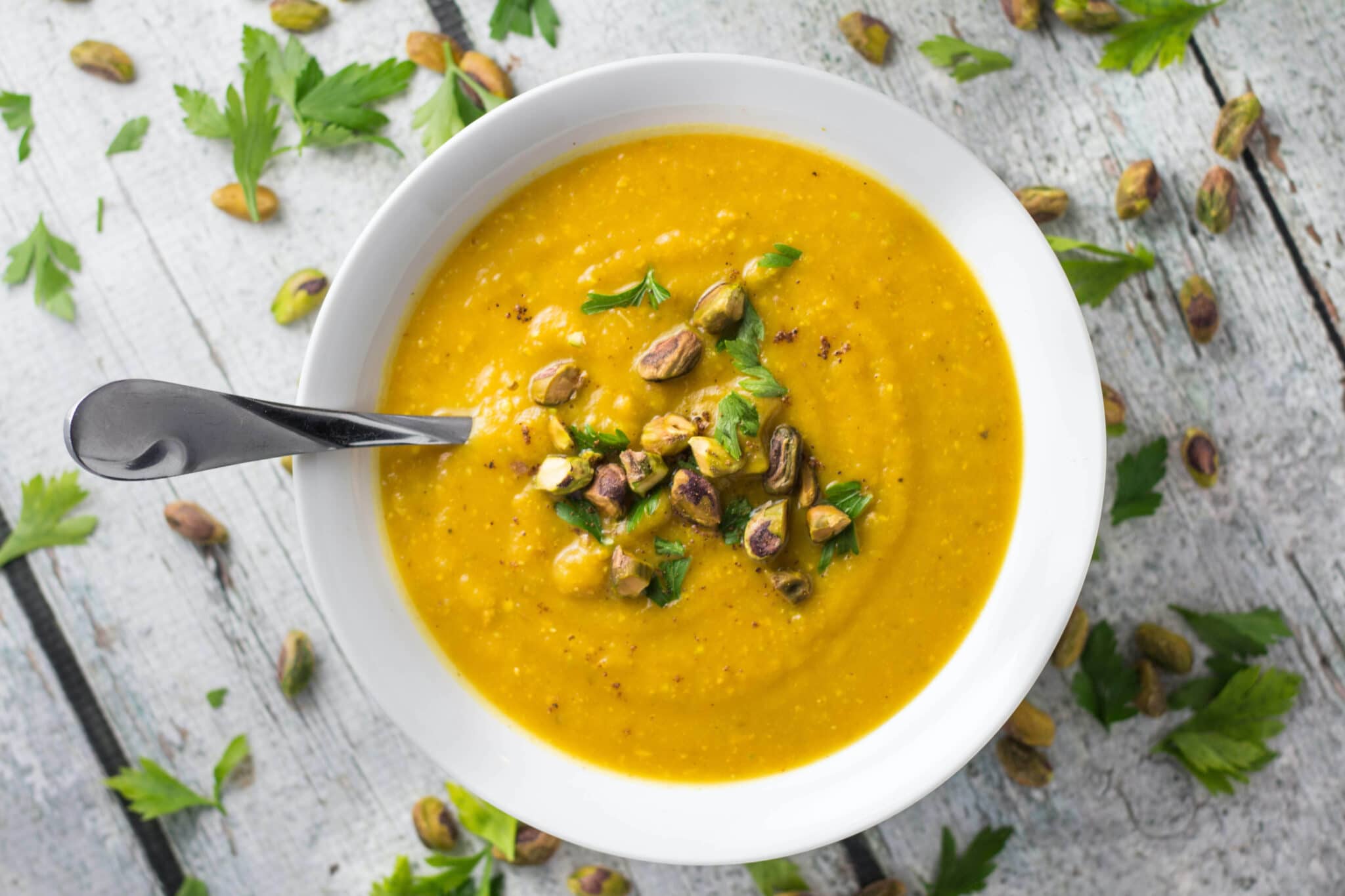 pistachio soup in a white bowl