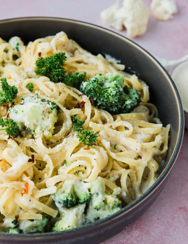 pasta in a bowl with broccoli and cauliflower sauce