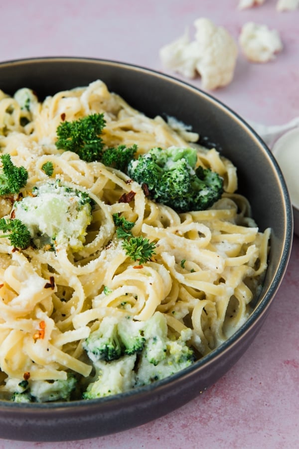 pasta in a bowl with broccoli and cauliflower sauce