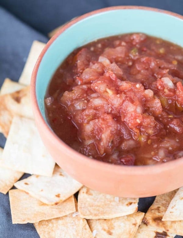 This 10 Minute Vitamix Salsa can be whipped up in 10 minutes or less! In the height of tomato season, this salsa is a must - plus with homemade tortilla chips you can't go wrong! |Krollskorner.com