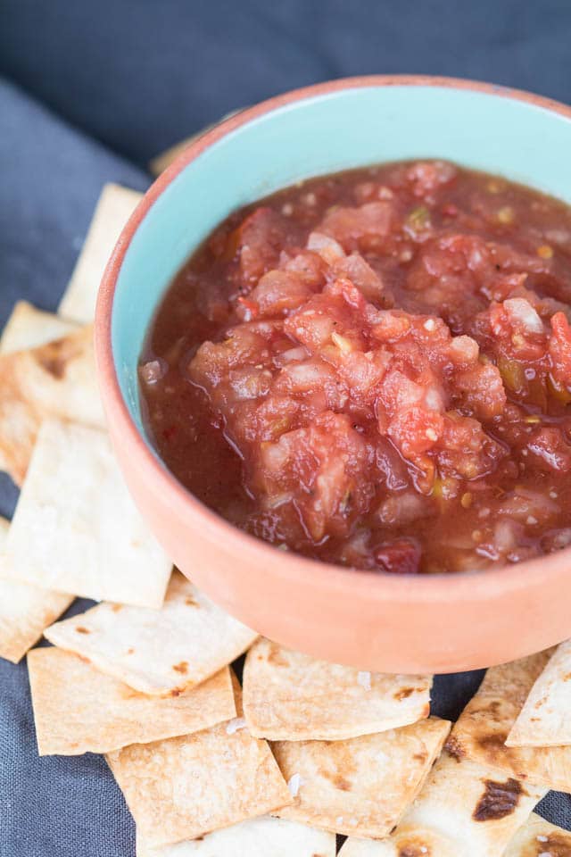 This 10 Minute Vitamix Salsa can be whipped up in 10 minutes or less! In the height of tomato season, this salsa is a must - plus with homemade tortilla chips you can't go wrong! |Krollskorner.com
