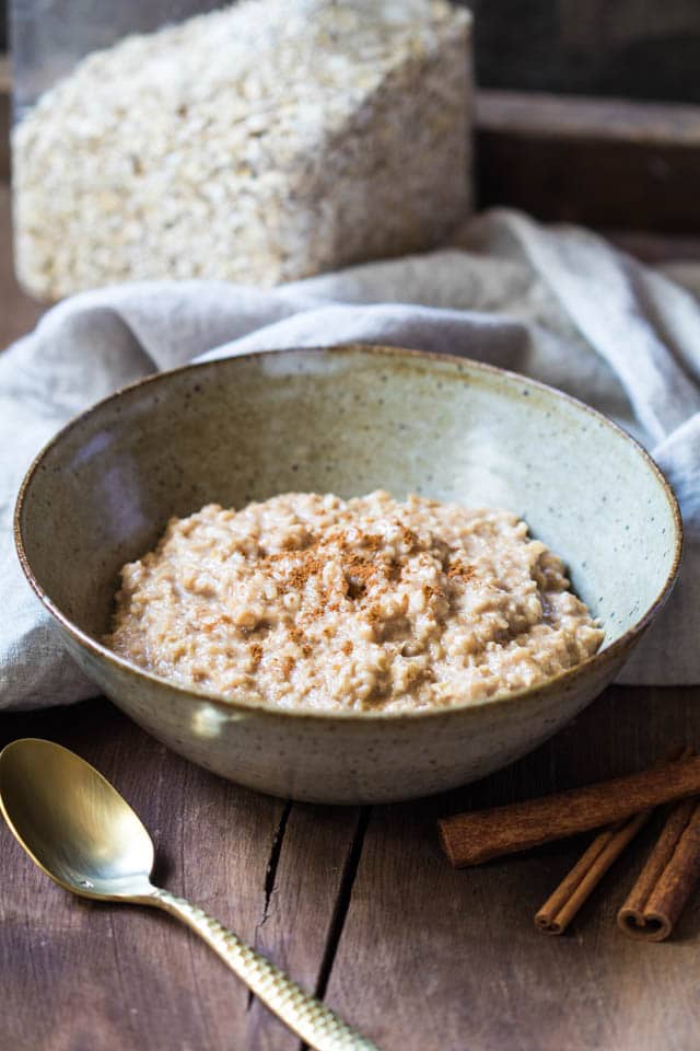 Oatmeal in a bowl on a wooden board