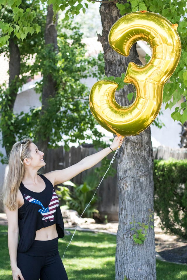 A woman holding a balloon