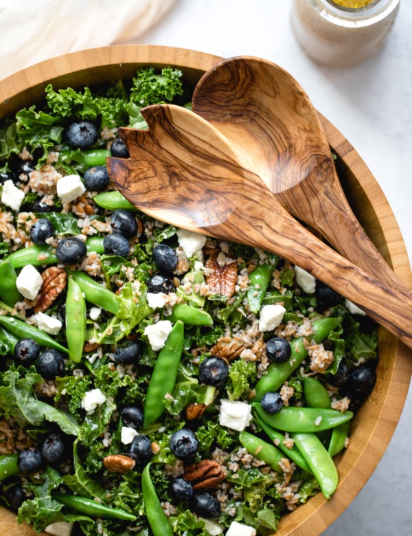 kale salad in a wood bowl