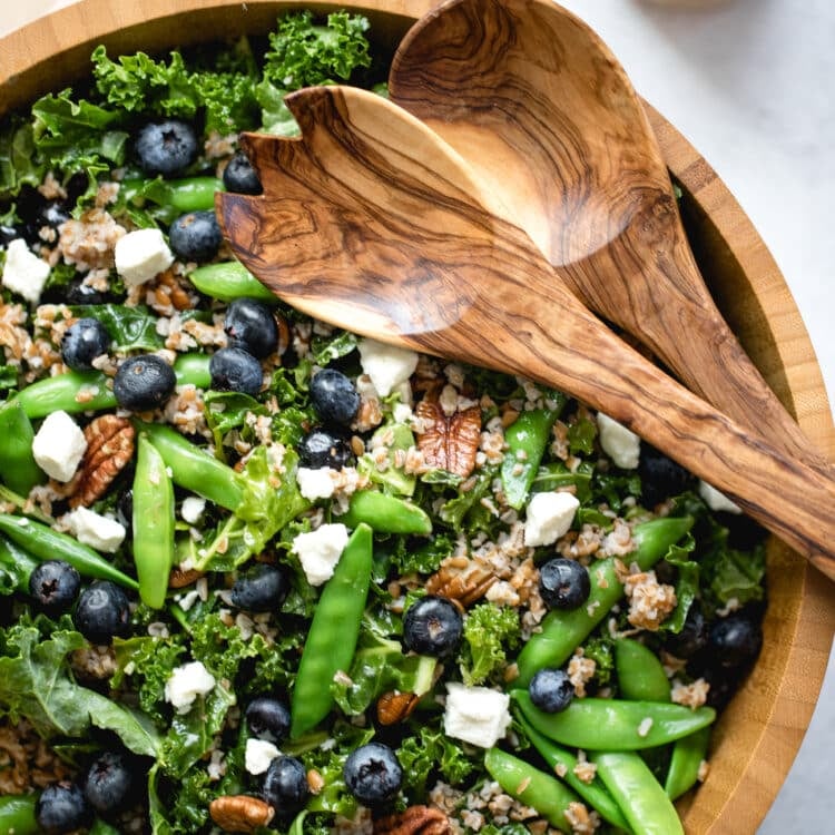 kale salad in a wood bowl