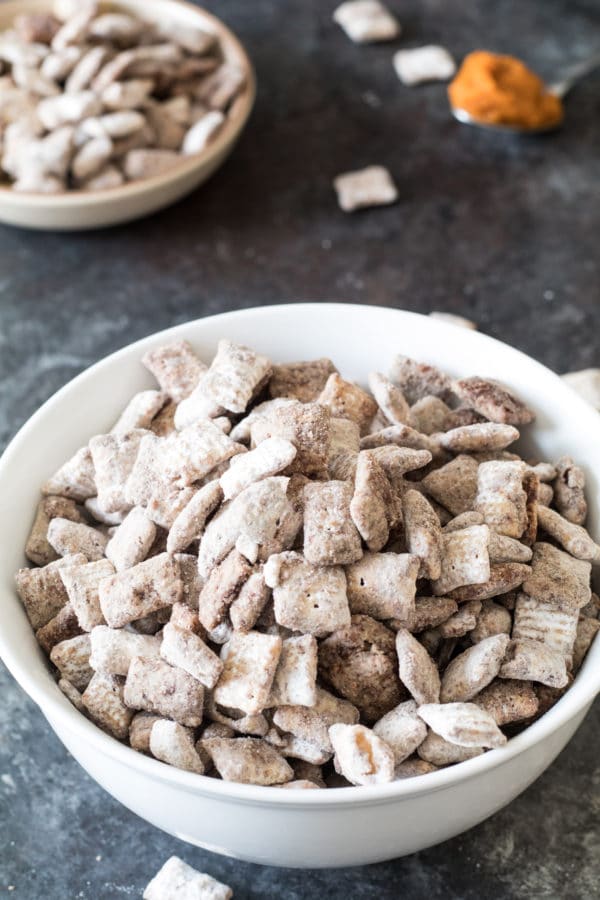 Rice chex with pumpkin pie flavors in a white bowl