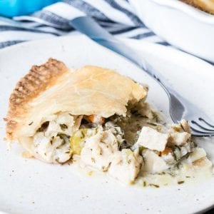 a slice of pot pie on a white plate