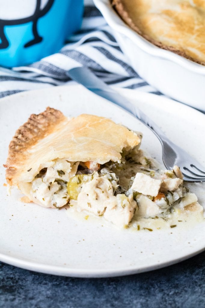 a slice of pot pie on a white plate