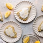 scones on white plates topped with glaze