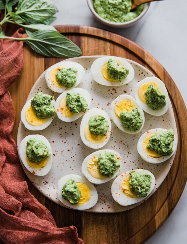 hard boiled eggs with parmesan pesto over them