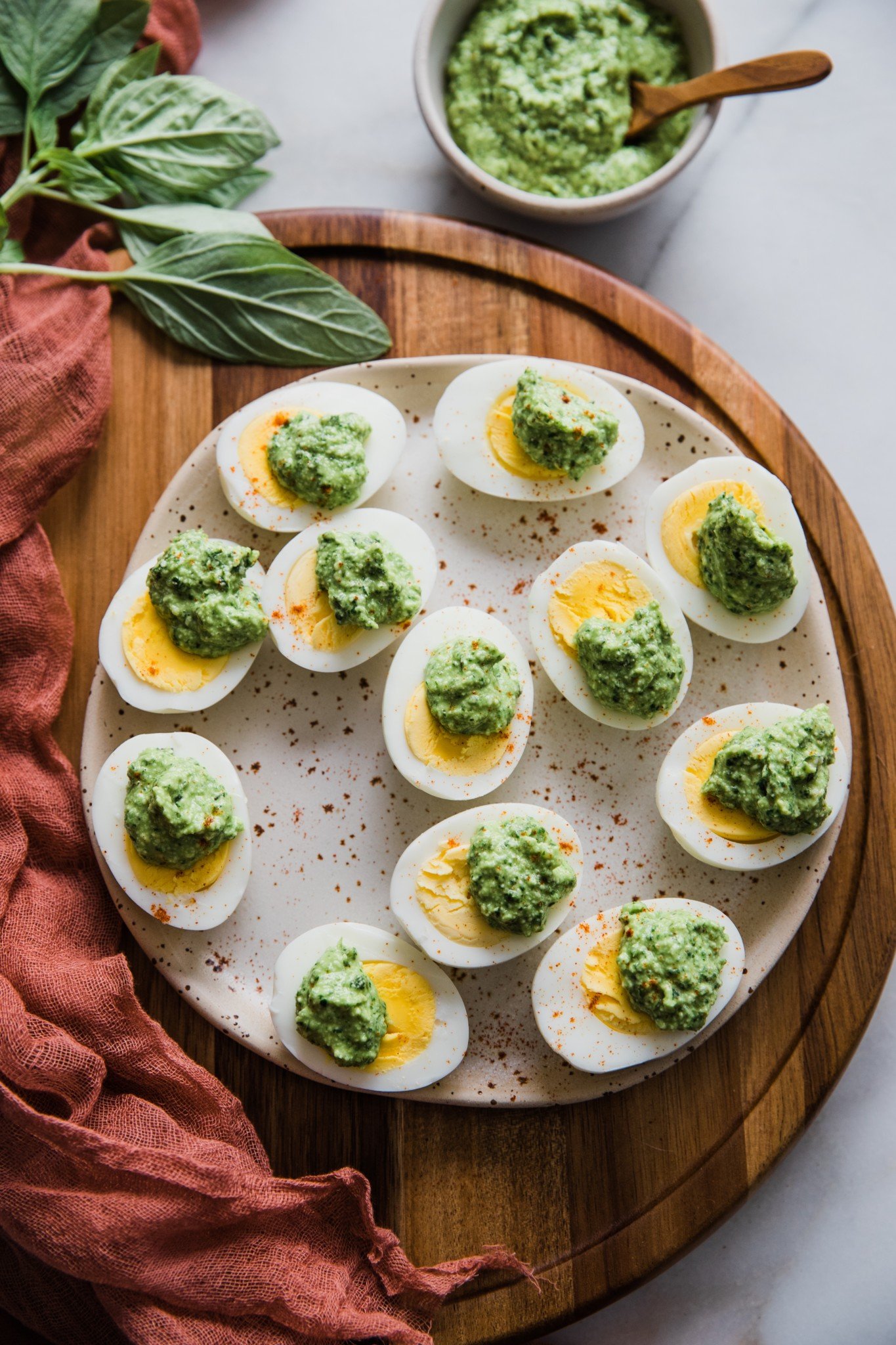 hard boiled eggs with parmesan pesto over them