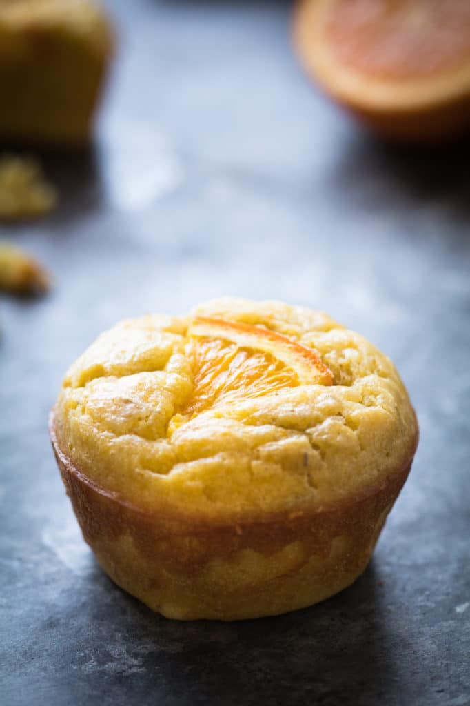 olive oil orange muffin on a blue board