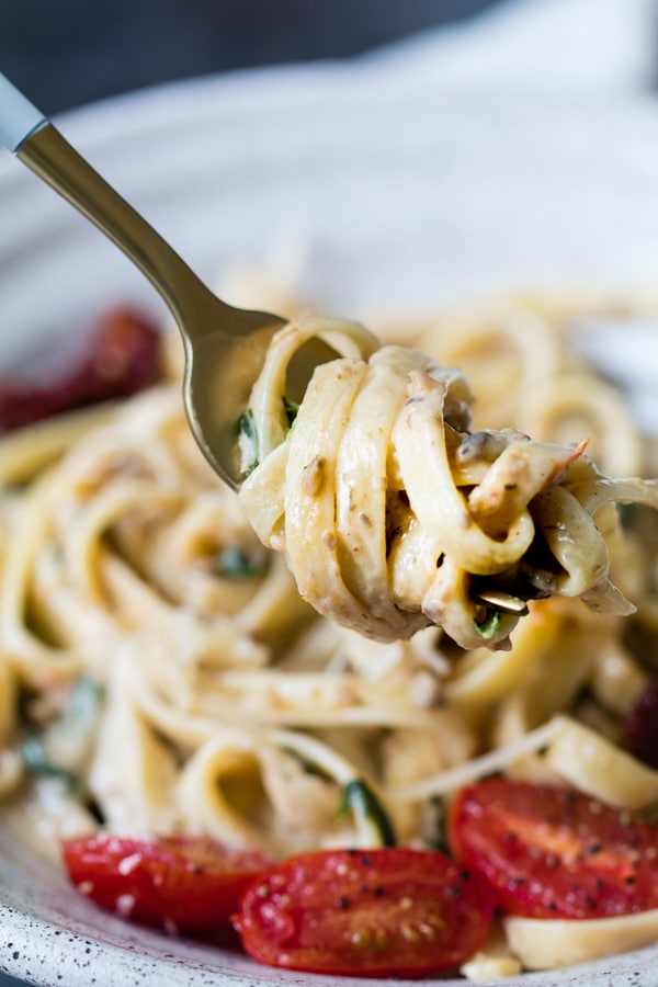 mushroom sauce with pasta on a fork