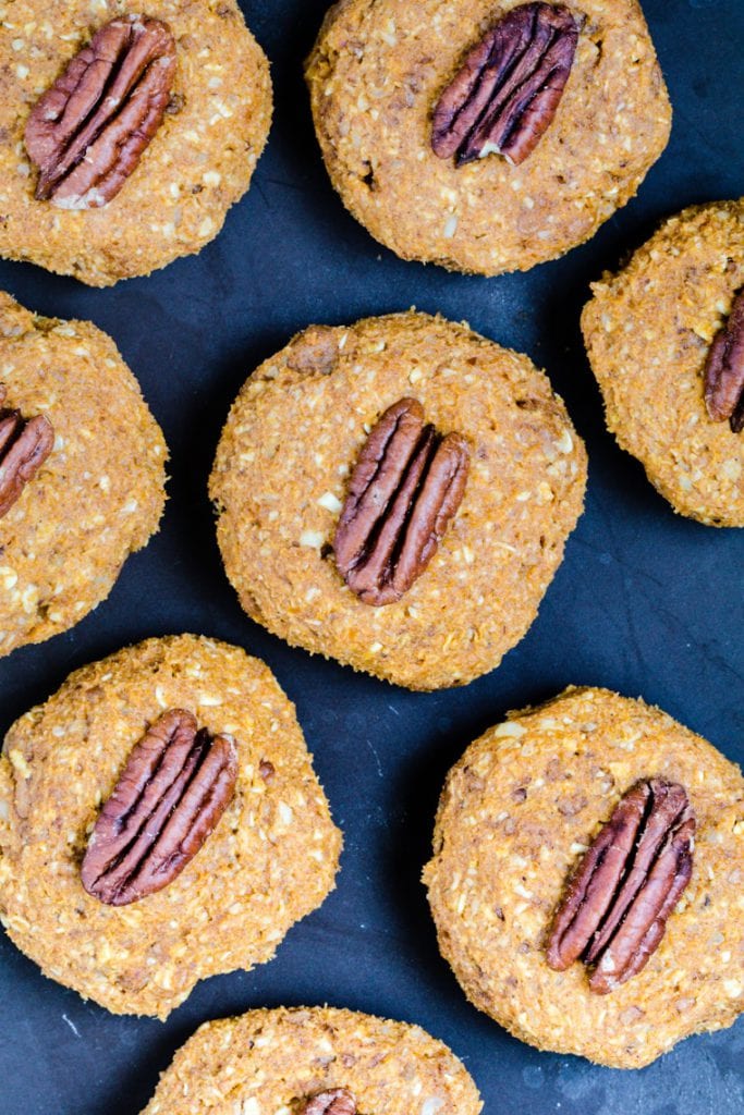 Pumpkin Pecan Cookies made with Medjool Dates topped with a pecan.
