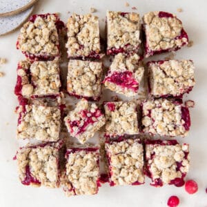 cranberry oatmeal bars on parchment paper