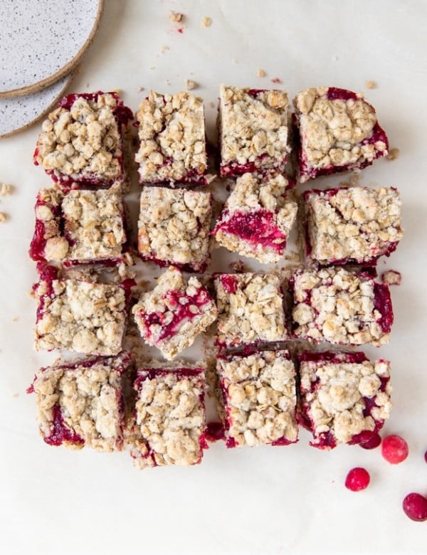 cranberry oatmeal bars on parchment paper