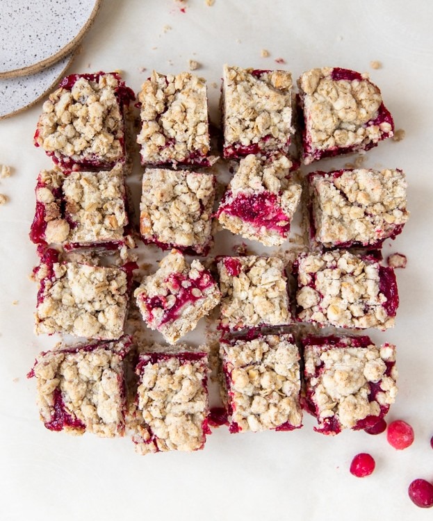 cranberry oatmeal bars on parchment paper