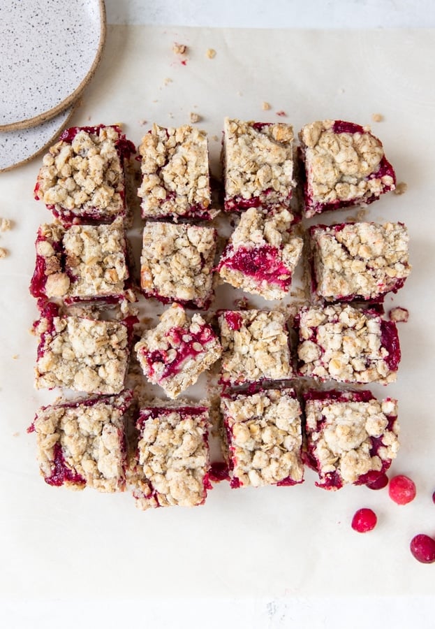 cranberry oatmeal bars on parchment paper