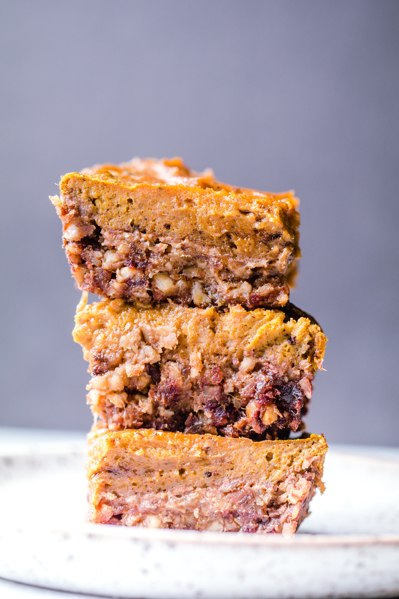 pumpkin pie bars stacked on top of each other