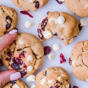White chocolate cranberry cookies on a marble slab