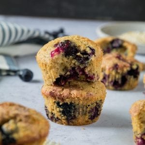 blueberry muffins on a white table