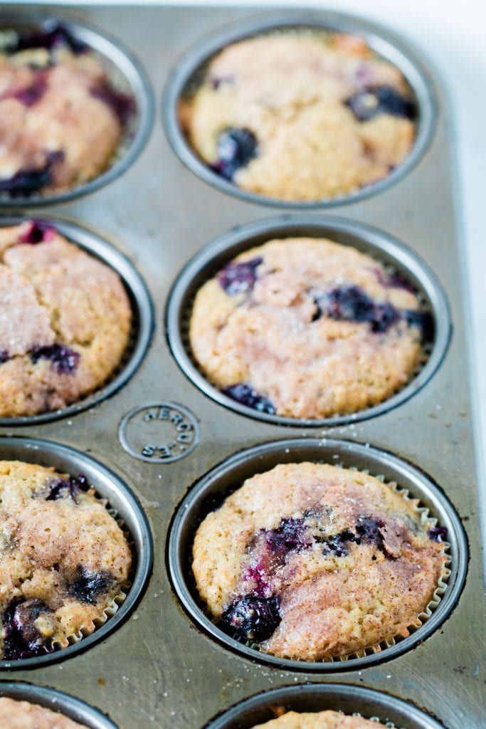 blueberry cinnamon muffins in a muffin tin