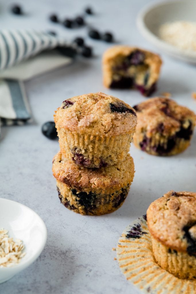blueberry cinnamon muffins stacked on a white board
