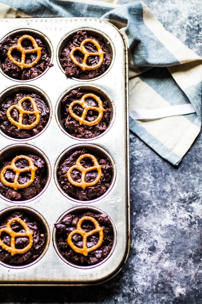 Brownie Bites in a cupcake tin with a pretzel on top