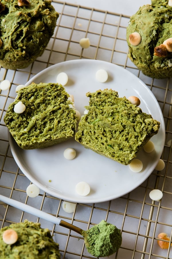 Muffins made with matcha and avocado on a white plate.