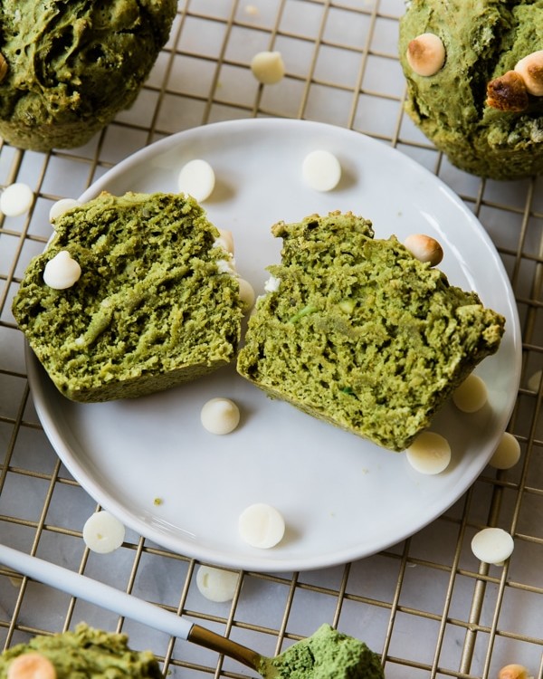 Muffins made with matcha and avocado on a white plate.