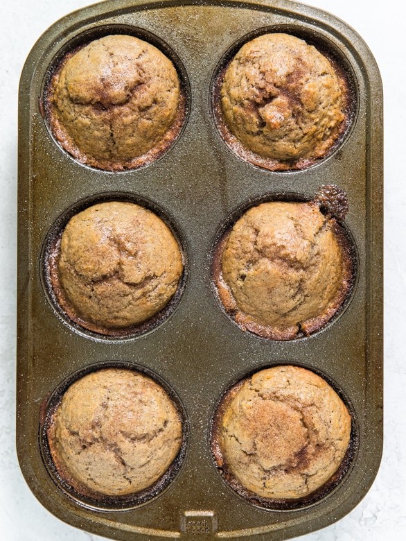 snickerdoodle muffins in a muffin tin