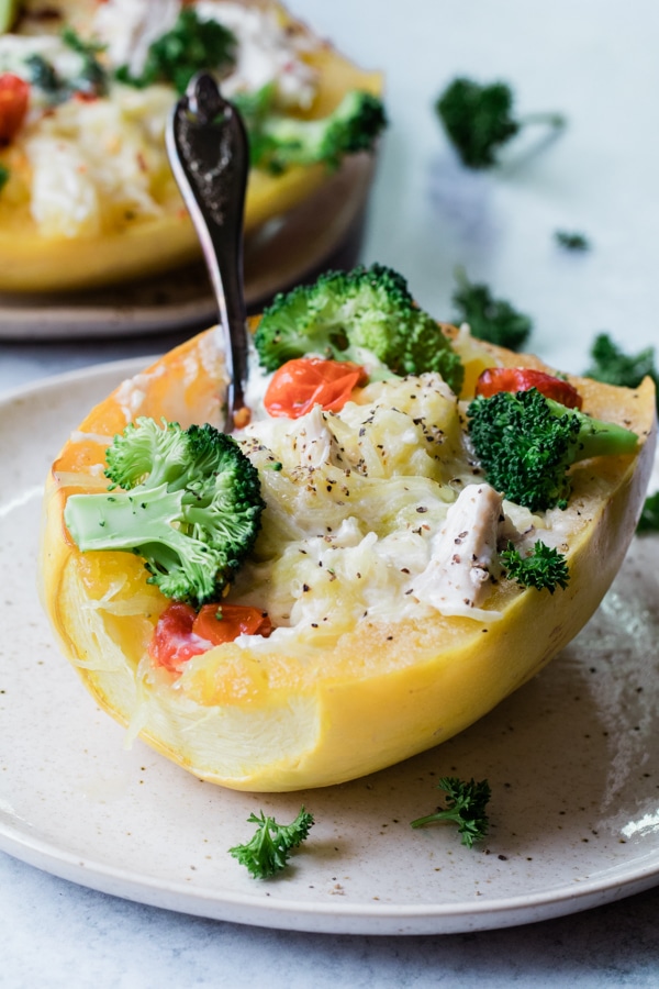 spaghetti squash chicken alfredo with fork stuck in it