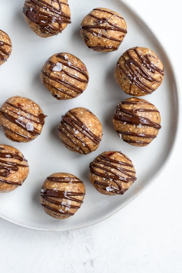 energy balls drizzled with chocolate and flaky sea salt