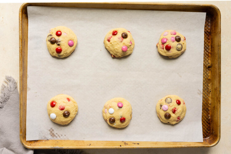freshly baked cookies on a baking sheet lined with parchment paper.