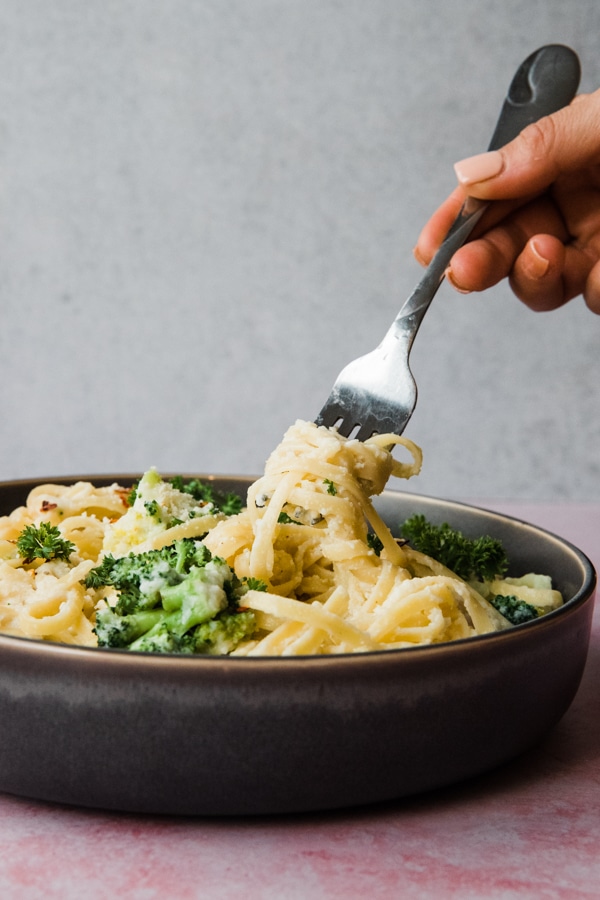 pasta made with a cauliflower sauce in a gray bowl