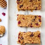 homemade granola bars on an off white plate