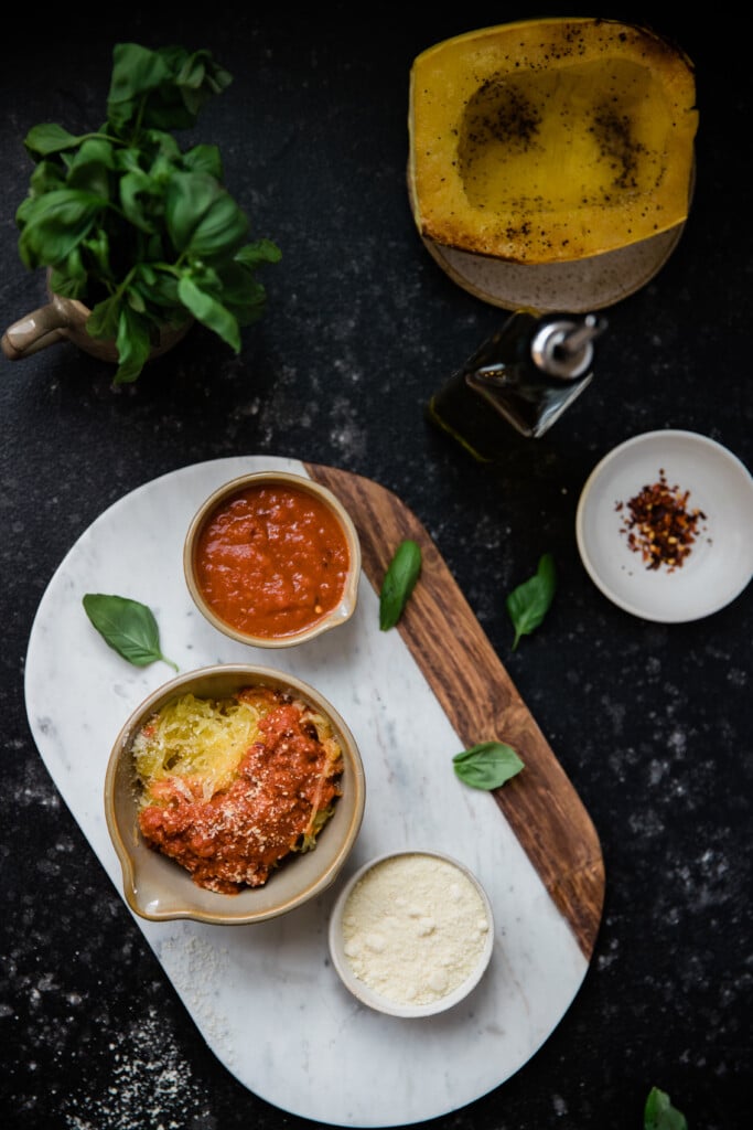 a cooked spaghetti squash on a marble board