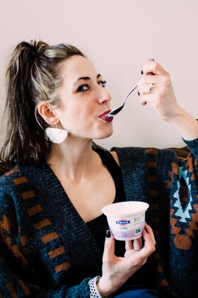 a girl eating yogurt