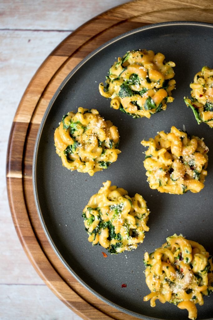 macaroni and cheese cups on a gray plate