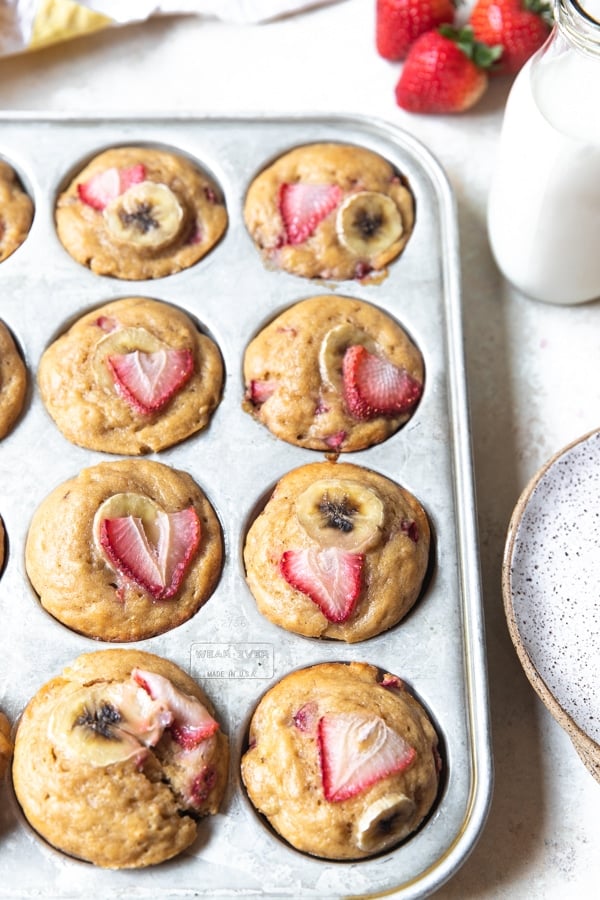 strawberry banana muffins in a muffin tin