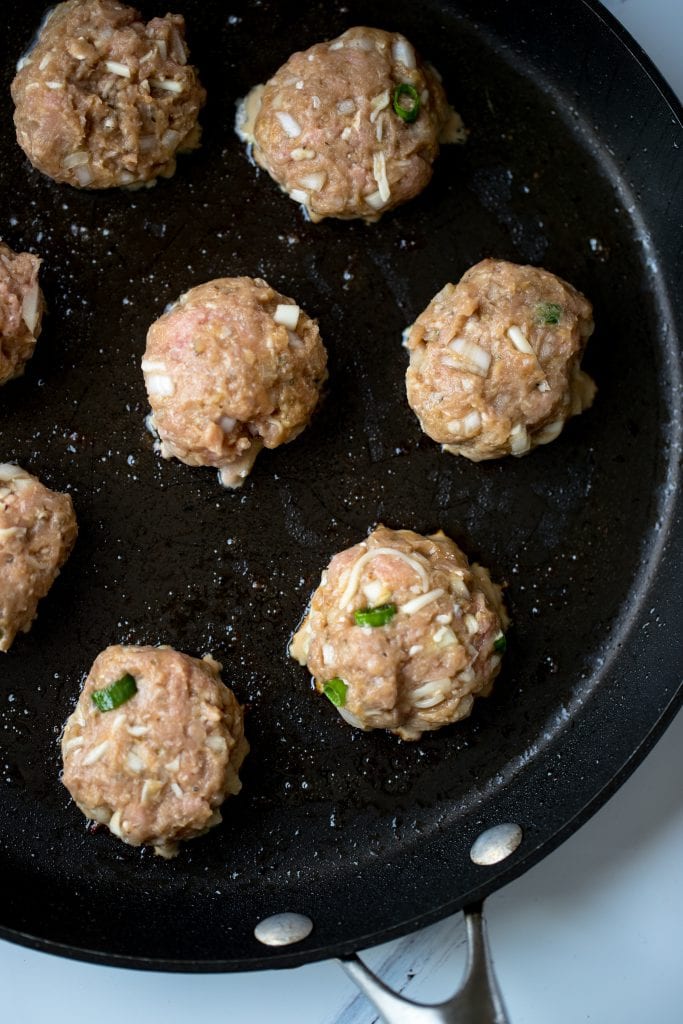 ground turkey sliders being cooked in a large pan