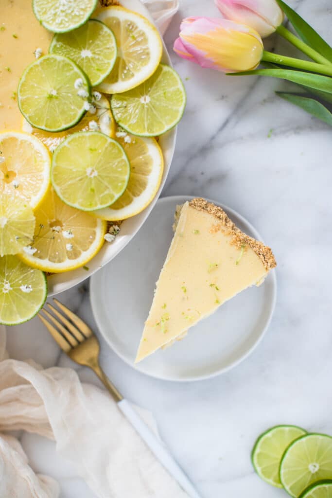 a slice of key lime pie on a white plate