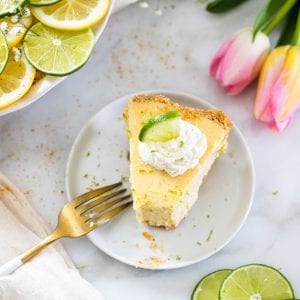 key lime with on a marble board with whipped cream on top