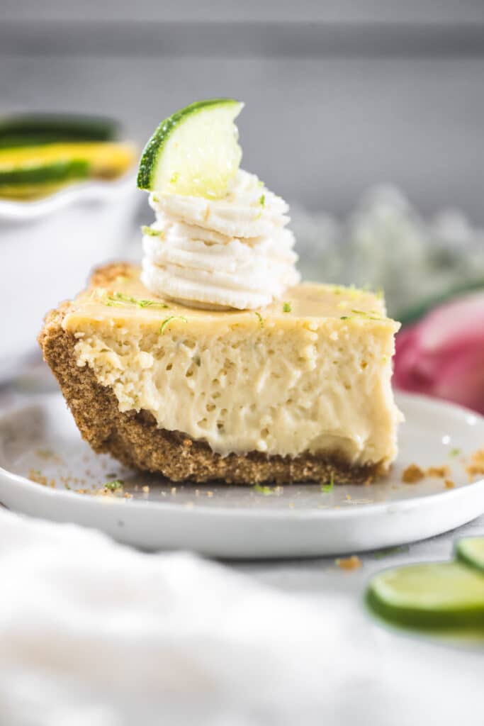 a slice of key lime pie with whipped cream on top